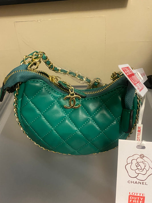 Green crossbody bag with gold chains